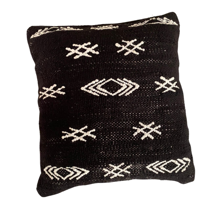 Embroidered black cushion