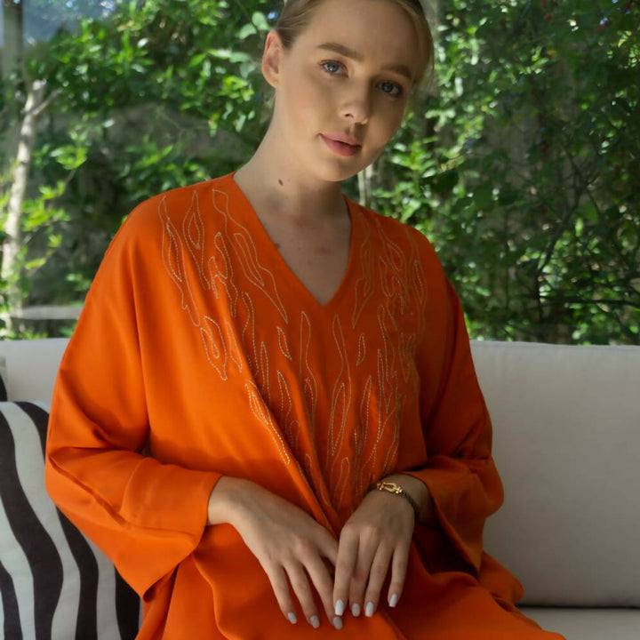 Orange embroidered caftan with fire motif