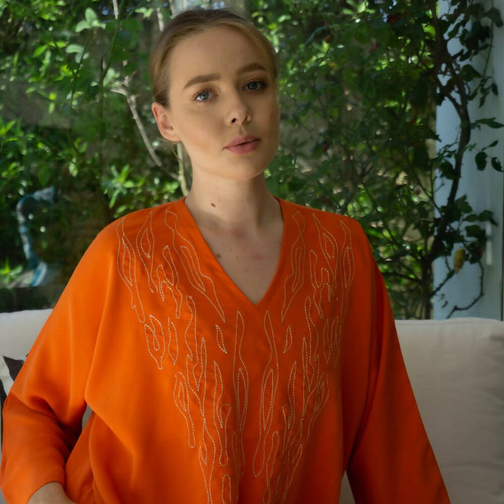 Orange embroidered caftan with fire motif