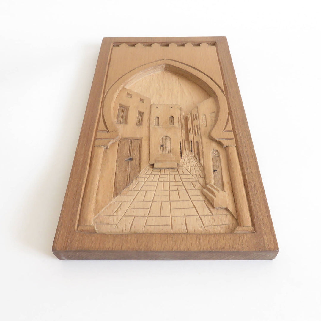 Wood relief carving narrow alleyway (madina)