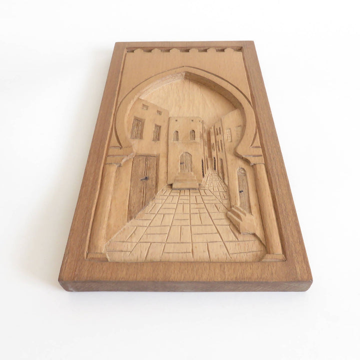 Wood relief carving narrow alleyway (madina)
